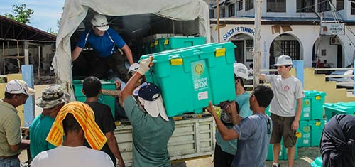Men unloading a truck with emergency supplies