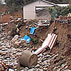 Photo of mud and debris sliding down a hill.